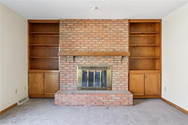 47 Tudor Ln Unit 6C, Kent, OH 44240 - unfurnished living room featuring carpet, a brick fireplace, baseboards, and built in features