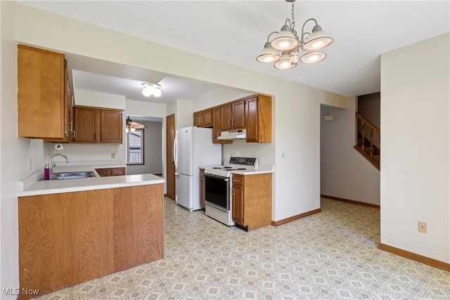 47 Tudor Ln Unit 6C, Kent, OH 44240 - kitchen featuring white appliances, a sink, a chandelier, light countertops, and under cabinet range hood