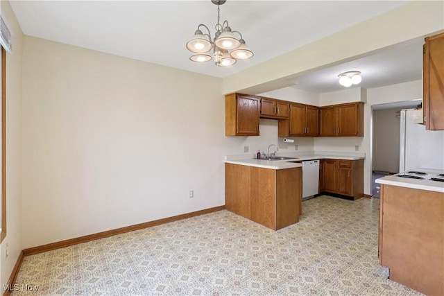 47 Tudor Ln Unit 6C, Kent, OH 44240 - kitchen featuring white appliances, a sink, brown cabinetry, a chandelier, and baseboards