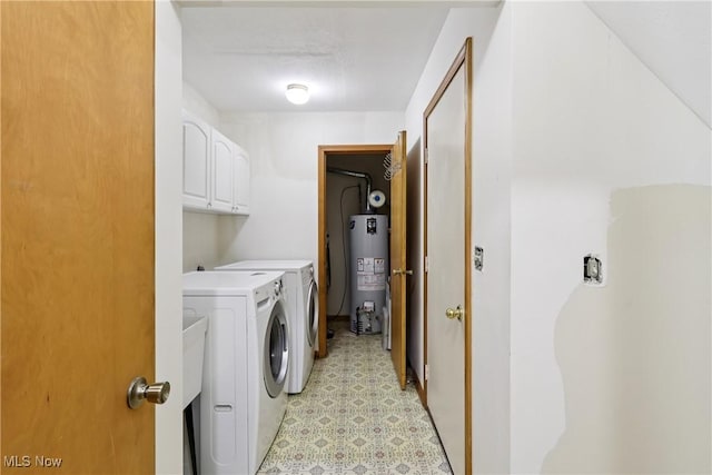 47 Tudor Ln Unit 6C, Kent, OH 44240 - laundry room with gas water heater, washing machine and clothes dryer, cabinet space, and light flooring