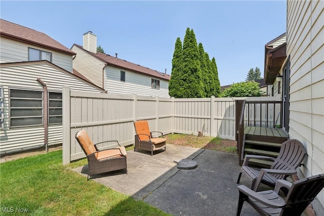 47 Tudor Ln Unit 6C, Kent, OH 44240 - fenced backyard with a patio area