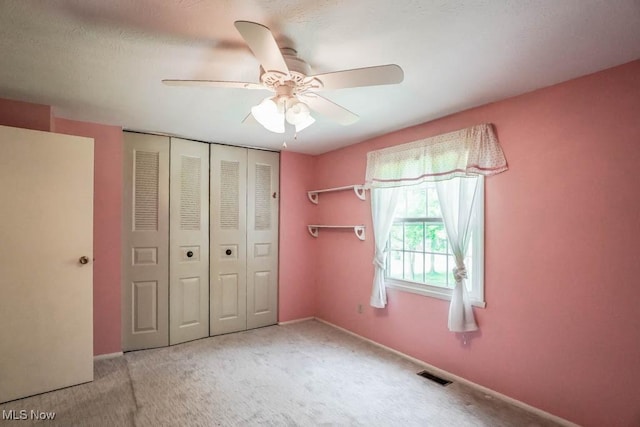 3888 Lake Run Blvd, Stow, OH 44224 - unfurnished bedroom with a closet, carpet flooring, a ceiling fan, and baseboards