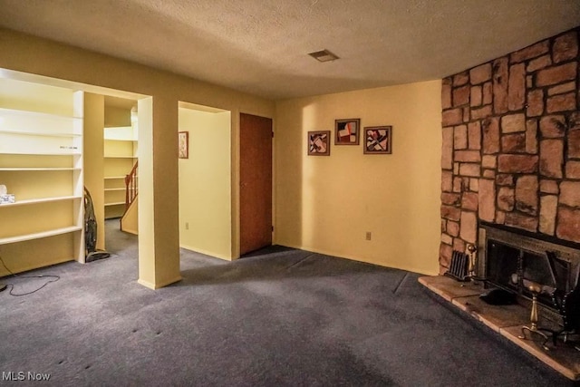3888 Lake Run Blvd, Stow, OH 44224 - unfurnished living room featuring carpet floors, a textured ceiling, stairs, and a stone fireplace