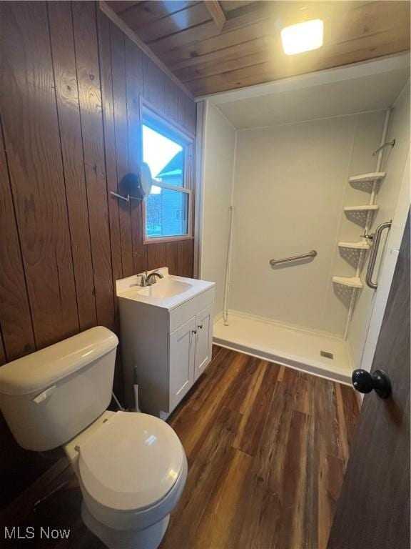 275 Cornell Ave, Amherst, OH 44001 - bathroom featuring wood finished floors, vanity, wooden walls, toilet, and wood ceiling