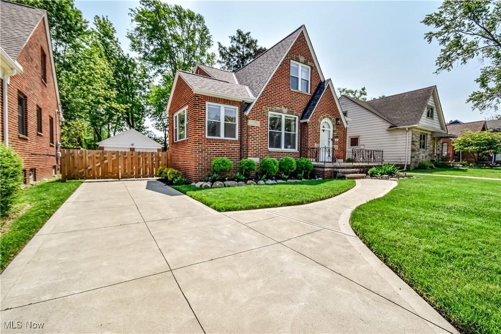 4315 W 215th St, Fairview Park, OH 44126 - english style home featuring brick siding and roof with shingles