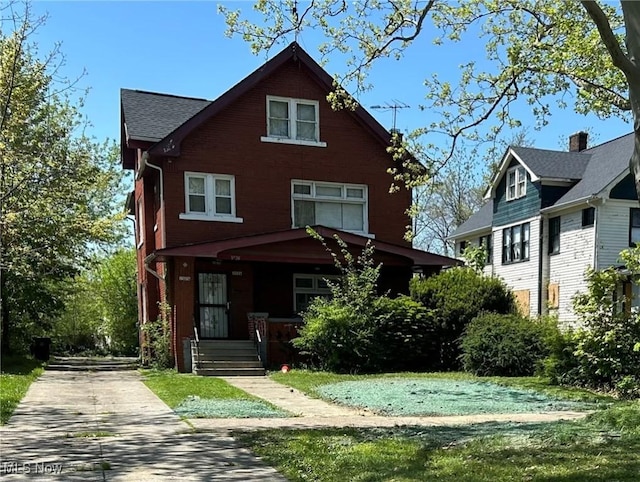 3526 E Blvd, Cleveland, OH 44105 - view of front of property featuring a porch, driveway, and a front lawn