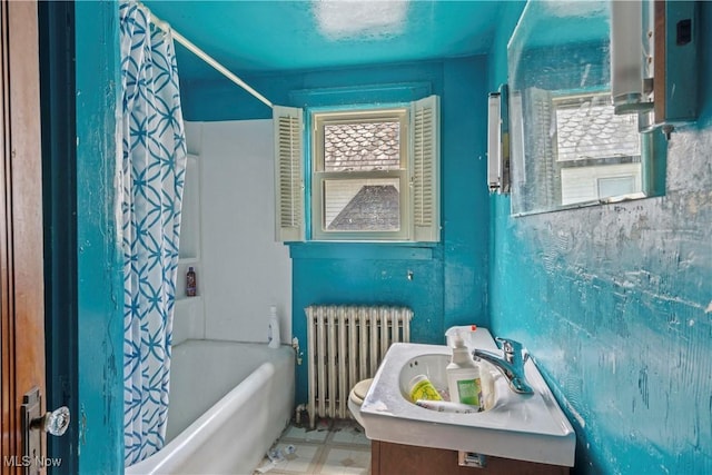 310 N Bentley Ave, Niles, OH 44446 - full bathroom featuring radiator, shower / bath combo with shower curtain, vanity, toilet, and tile patterned floors