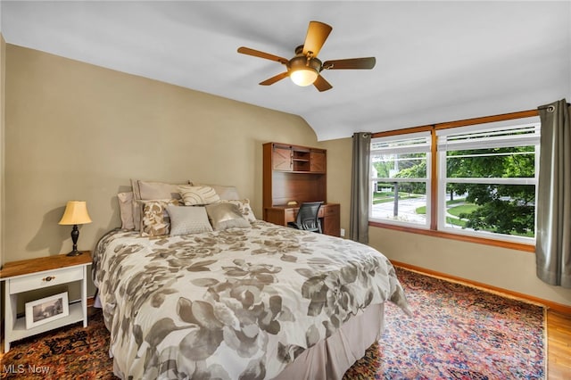 1167 Croyden Rd, Lyndhurst, OH 44124 - bedroom with baseboards, vaulted ceiling, a ceiling fan, and wood finished floors
