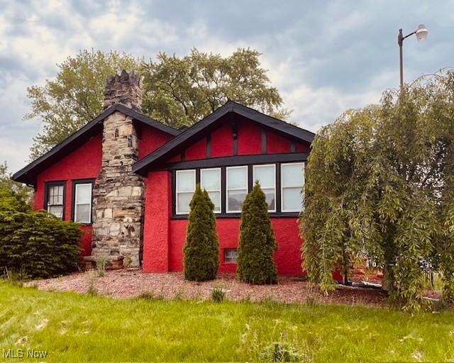 200 Stewart Ave NW, Massillon, OH 44646 - view of front of home featuring a chimney
