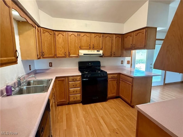 47 Walker Manor Cir, Colliers, WV 26035 - kitchen featuring black appliances, under cabinet range hood, light wood finished floors, brown cabinetry, and a peninsula