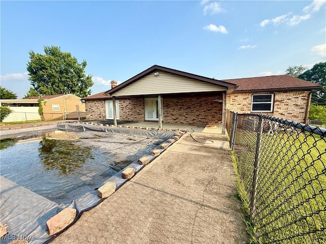 47 Walker Manor Cir, Colliers, WV 26035 - back of property with brick siding, a patio, and a shingled roof