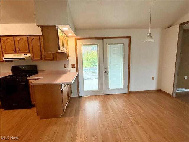 47 Walker Manor Cir, Colliers, WV 26035 - kitchen featuring black range with gas stovetop, under cabinet range hood, french doors, light countertops, and light wood-style flooring