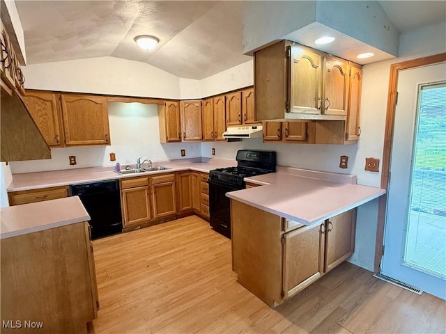 47 Walker Manor Cir, Colliers, WV 26035 - kitchen featuring black appliances, a peninsula, under cabinet range hood, vaulted ceiling, and light wood-type flooring