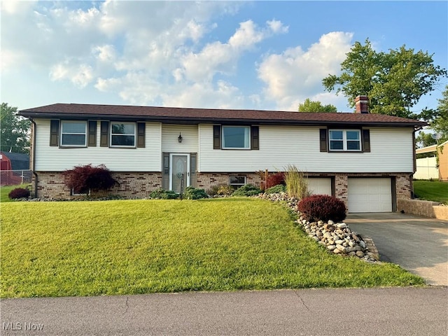 47 Walker Manor Cir, Colliers, WV 26035 - split foyer home featuring brick siding, a garage, asphalt driveway, a front lawn, and a chimney
