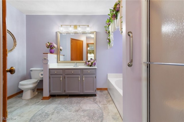 5472 Hancock St SW, Canton, OH 44706 - bathroom featuring a bath, toilet, vanity, and baseboards