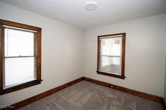 942 Harrison Ave, Akron, OH 44314 - empty room featuring carpet flooring and baseboards