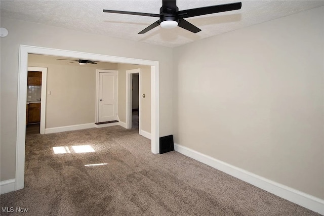 942 Harrison Ave, Akron, OH 44314 - carpeted spare room featuring a ceiling fan, a textured ceiling, and baseboards