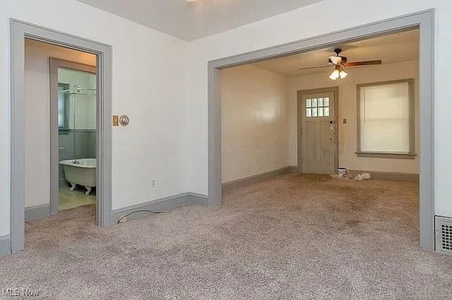 942 Harrison Ave, Akron, OH 44314 - spare room with carpet, ceiling fan, and baseboards