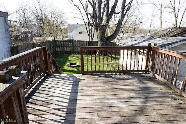 942 Harrison Ave, Akron, OH 44314 - wooden deck with an outdoor fire pit