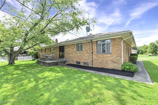 321 Justo Ln, Seven Hills, OH 44131 - back of house with brick siding and a patio