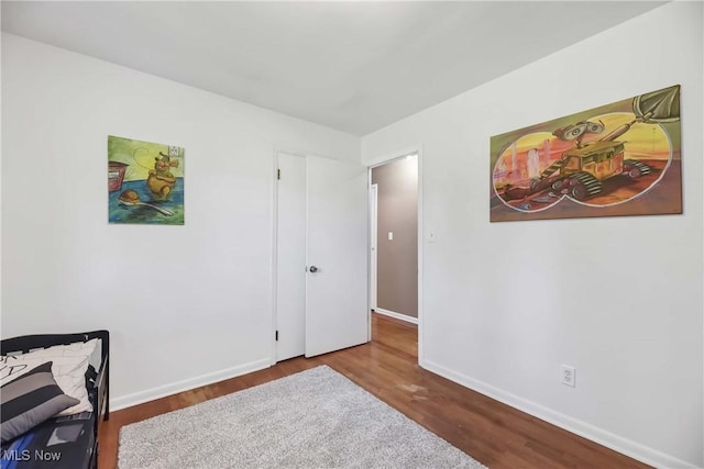 321 Justo Ln, Seven Hills, OH 44131 - bedroom featuring wood finished floors and baseboards