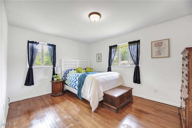 321 Justo Ln, Seven Hills, OH 44131 - bedroom featuring light wood-style flooring and baseboards