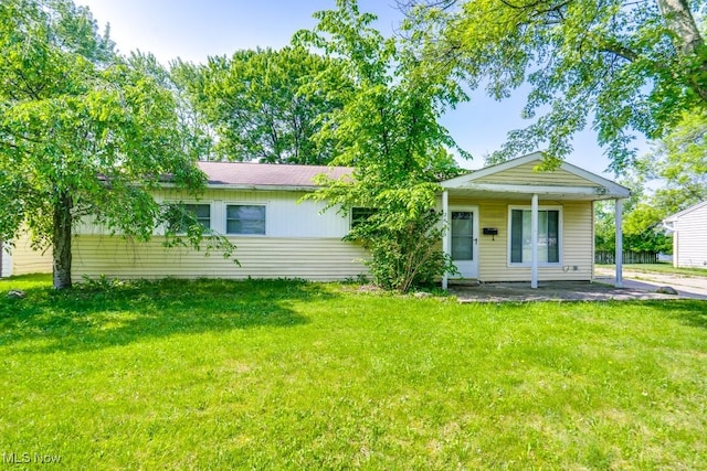 24120 Sherborne Rd, Bedford Heights, OH 44146 - view of front facade with a front lawn