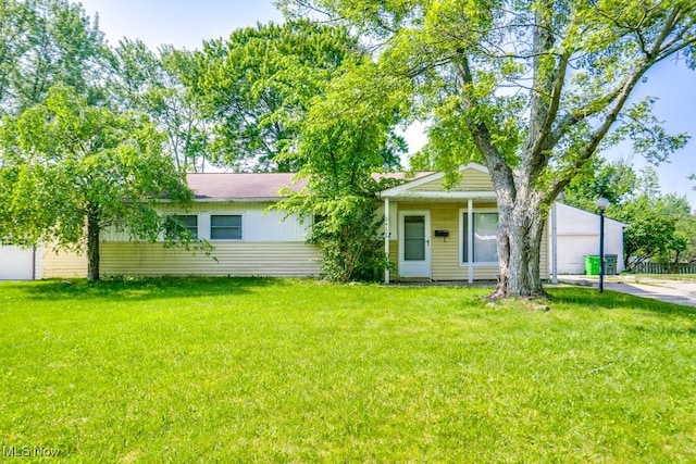 24120 Sherborne Rd, Bedford Heights, OH 44146 - view of front of home featuring a front lawn and a garage