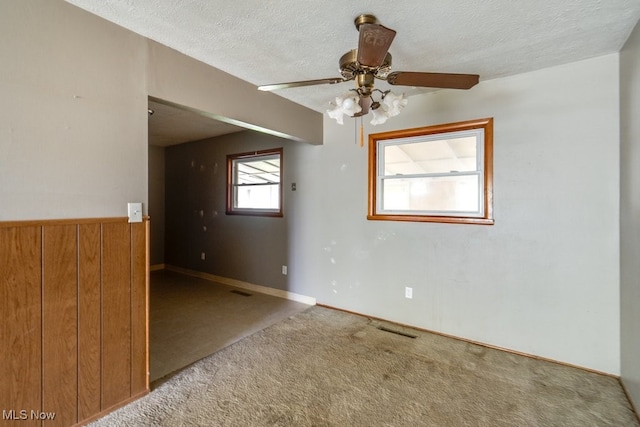 24120 Sherborne Rd, Bedford Heights, OH 44146 - unfurnished room featuring carpet flooring, a ceiling fan, and a textured ceiling