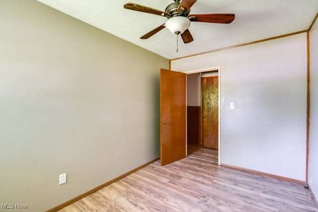 24120 Sherborne Rd, Bedford Heights, OH 44146 - unfurnished room with wood finished floors, a ceiling fan, and baseboards
