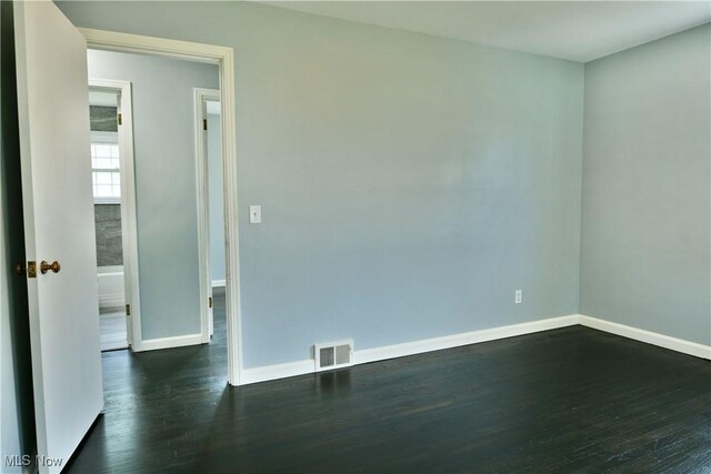 859 Gary Ave, Girard, OH 44420 - unfurnished room with dark wood-style flooring and baseboards