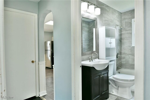859 Gary Ave, Girard, OH 44420 - bathroom featuring vanity, toilet, tub / shower combination, and tile patterned flooring