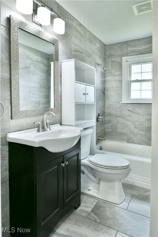 859 Gary Ave, Girard, OH 44420 - full bathroom featuring toilet, vanity, and bathtub / shower combination