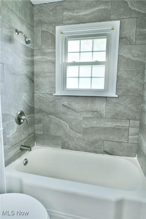 859 Gary Ave, Girard, OH 44420 - bathroom featuring toilet and shower / tub combination