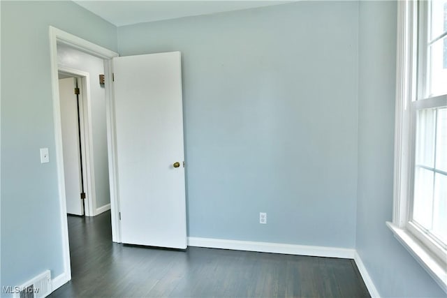 859 Gary Ave, Girard, OH 44420 - spare room featuring dark wood finished floors and baseboards