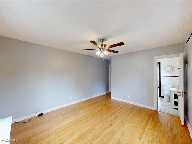 18515 Lomond Blvd, Shaker Heights, OH 44122 - unfurnished room featuring light wood-style floors, ceiling fan, and baseboards