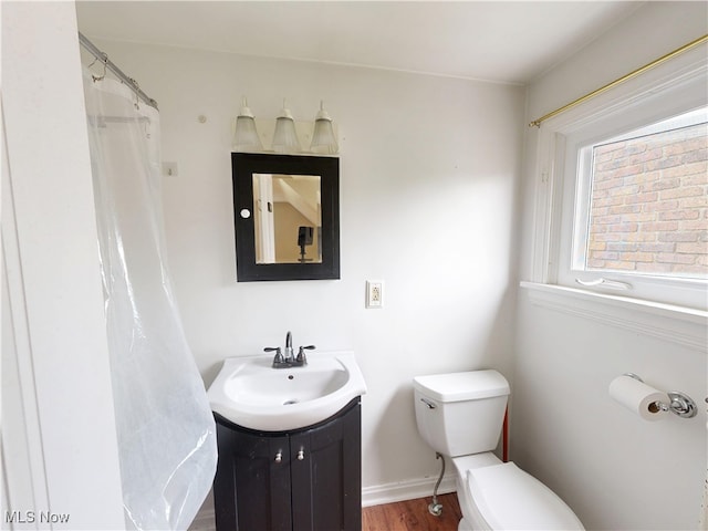 18515 Lomond Blvd, Shaker Heights, OH 44122 - bathroom featuring toilet, vanity, and wood finished floors