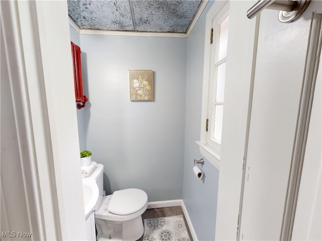 18515 Lomond Blvd, Shaker Heights, OH 44122 - bathroom with wood finished floors, toilet, baseboards, and healthy amount of natural light