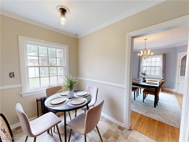 18515 Lomond Blvd, Shaker Heights, OH 44122 - dining room featuring a chandelier, ornamental molding, baseboards, and light wood finished floors