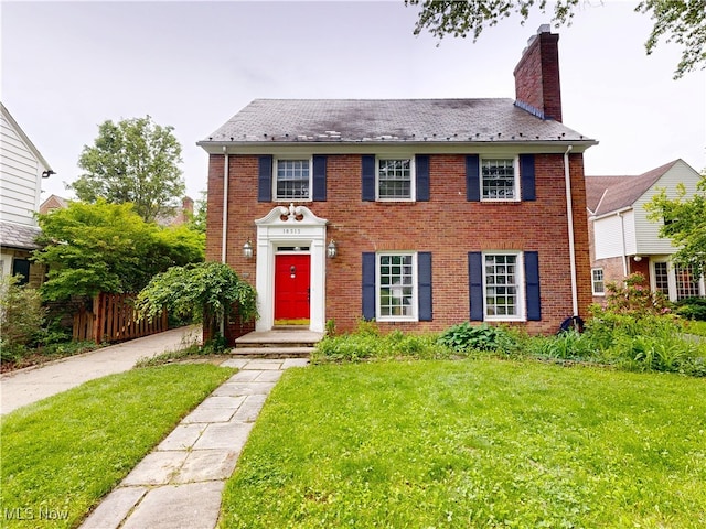 18515 Lomond Blvd, Shaker Heights, OH 44122 - view of front facade featuring a chimney and brick siding