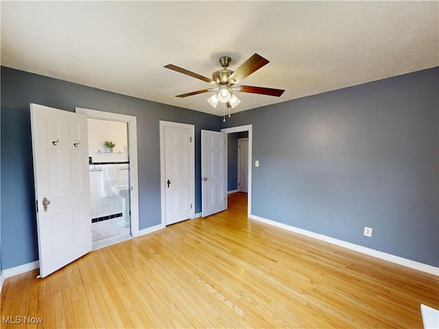 18515 Lomond Blvd, Shaker Heights, OH 44122 - unfurnished bedroom featuring baseboards, light wood finished floors, connected bathroom, and a ceiling fan