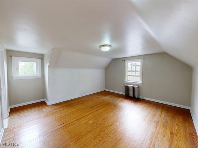 18515 Lomond Blvd, Shaker Heights, OH 44122 - bonus room featuring radiator, light wood-style floors, vaulted ceiling, and baseboards
