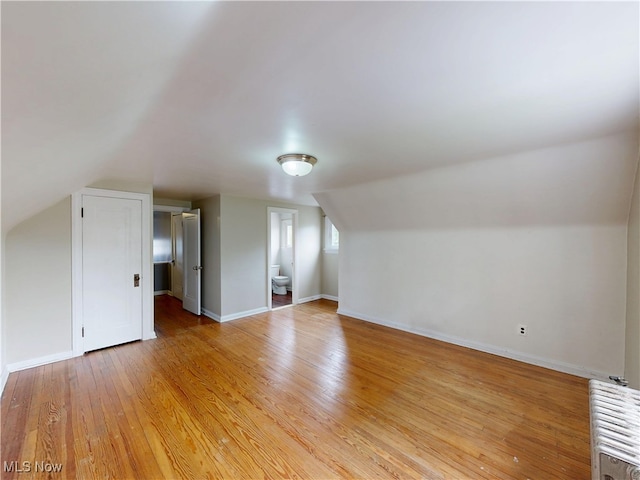 18515 Lomond Blvd, Shaker Heights, OH 44122 - bonus room featuring vaulted ceiling, light wood finished floors, baseboards, and radiator
