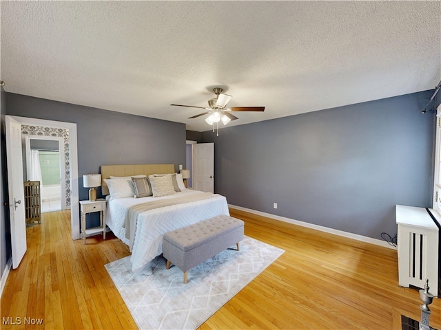 18515 Lomond Blvd, Shaker Heights, OH 44122 - bedroom featuring light wood-type flooring, a textured ceiling, baseboards, and ceiling fan