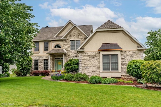 1103 Stone Crossing St NE, Canton, OH 44721 - craftsman inspired home with stone siding, stucco siding, a front yard, and roof with shingles