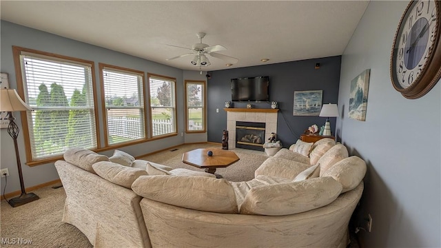 813 Buckeye Ln, Sandusky, OH 44870 - carpeted living room featuring ceiling fan, a tile fireplace, and baseboards