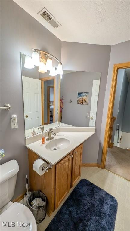 813 Buckeye Ln, Sandusky, OH 44870 - half bath with vanity, toilet, baseboards, and a chandelier