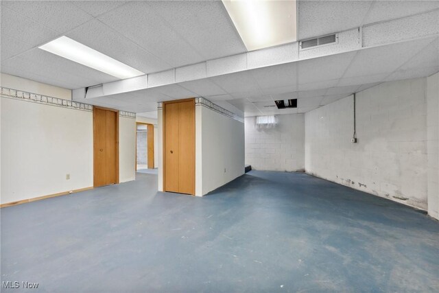 6791 Cedar Ridge Trl, Clinton, OH 44216 - finished below grade area featuring concrete block wall and a paneled ceiling
