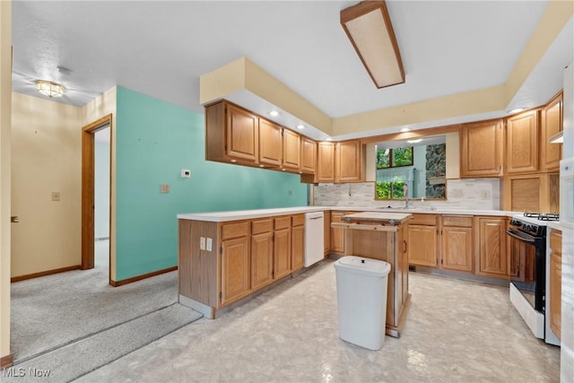 6791 Cedar Ridge Trl, Clinton, OH 44216 - kitchen featuring range with gas cooktop, dishwasher, decorative backsplash, light countertops, and a peninsula