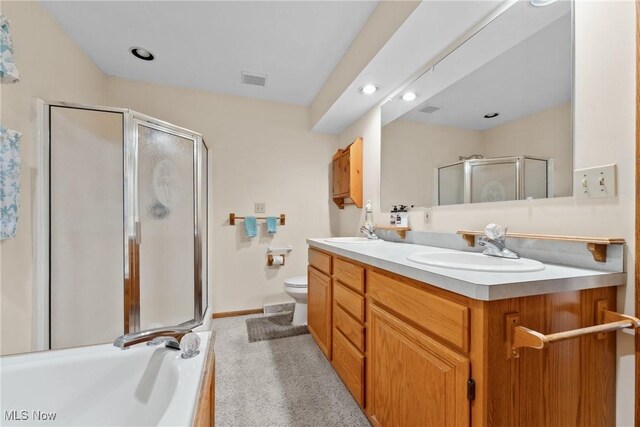 6791 Cedar Ridge Trl, Clinton, OH 44216 - full bath featuring a stall shower, double vanity, toilet, a tub, and recessed lighting